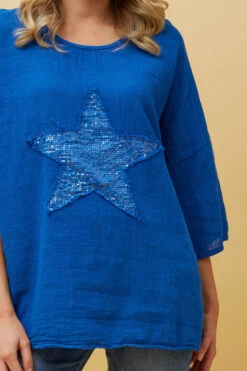 ZONYA SEQUIN STAR PATCH TOP -Femme Connection Sales 95fbd337a8c37ed8617a1304b9e62c13
